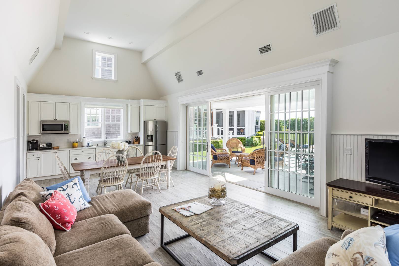 170 Scuttle Hole Road Water Mill, NY 11976 - Photo 32 of 35 a living room with furniture a flat screen tv and a large window