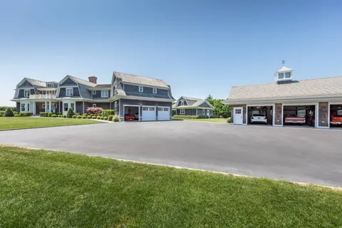 a view of multiple houses with a street