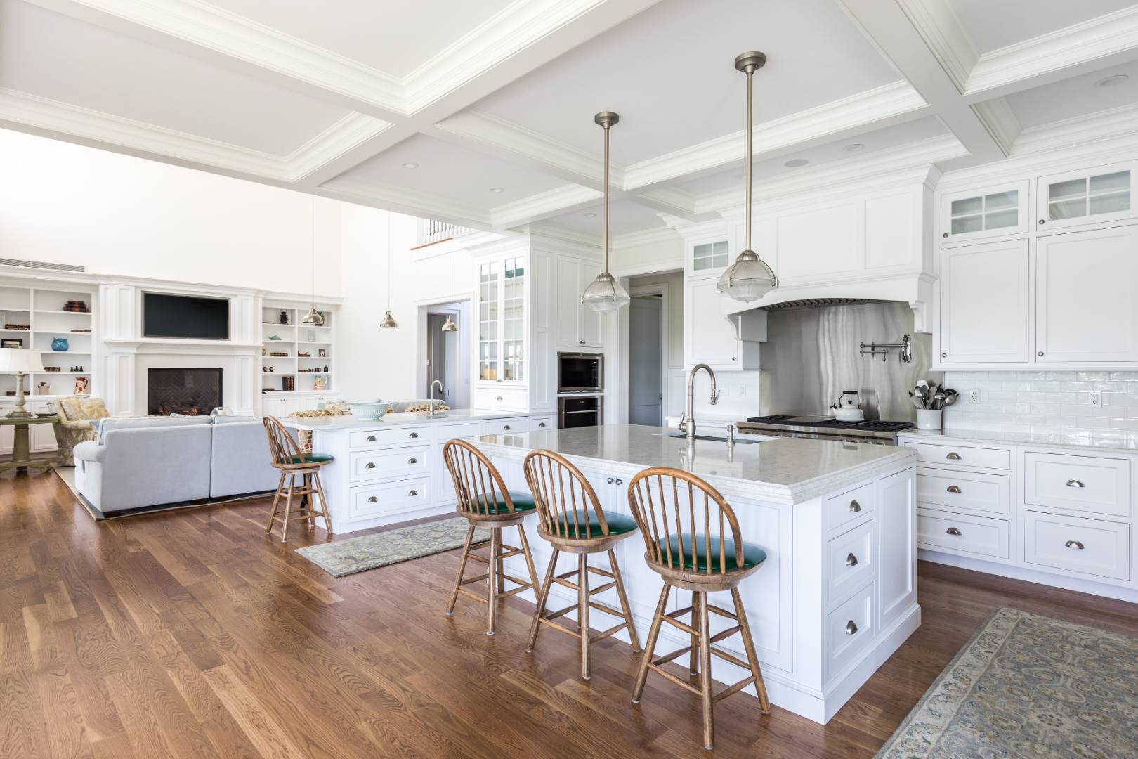 170 Scuttle Hole Road Water Mill, NY 11976 - Photo 8 of 35 a kitchen with stainless steel appliances a dining table chairs sink and cabinets