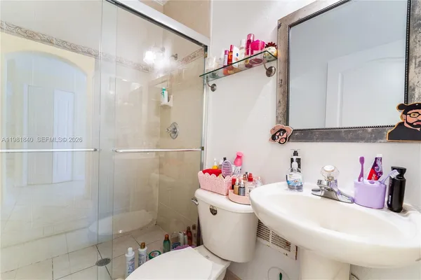 a view of storage and utility room with washer and dryer