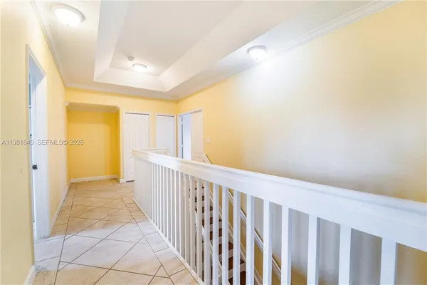 a bathroom with a tub a sink and large mirror