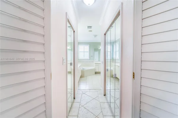 a bathroom with a double vanity sink mirror and toilet