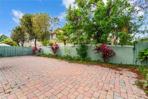 a backyard of a house with outdoor seating