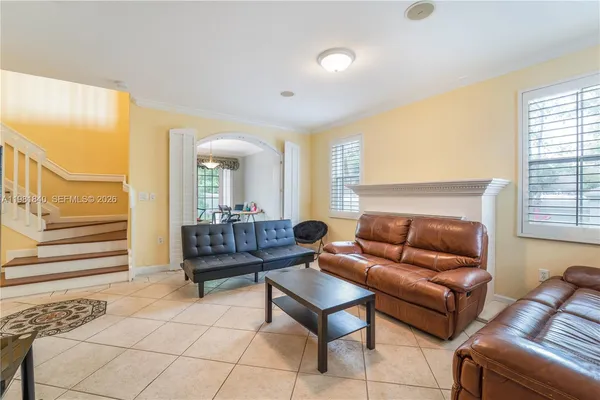 a living room with furniture and a window