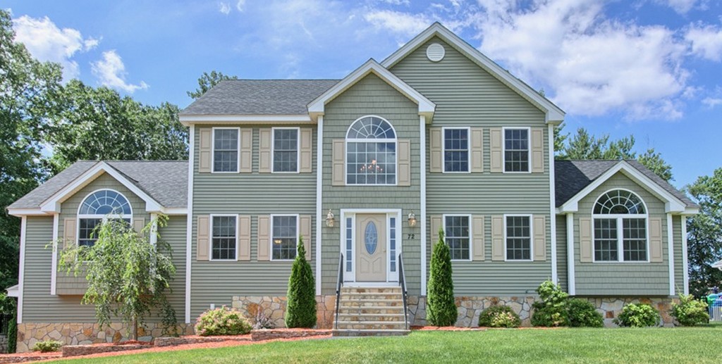 72 Clement Road Dracut, MA 01826 - Photo 1 of 30 a front view of a house with a yard and garage