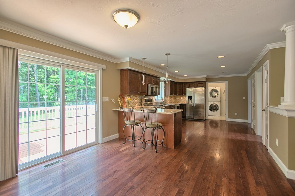 72 Clement Road Dracut, MA 01826 - Photo 14 of 30 a view of a dining room with furniture window and wooden floor