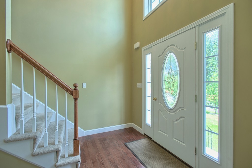 72 Clement Road Dracut, MA 01826 - Photo 17 of 30 a view of a livingroom with wooden floor and windows