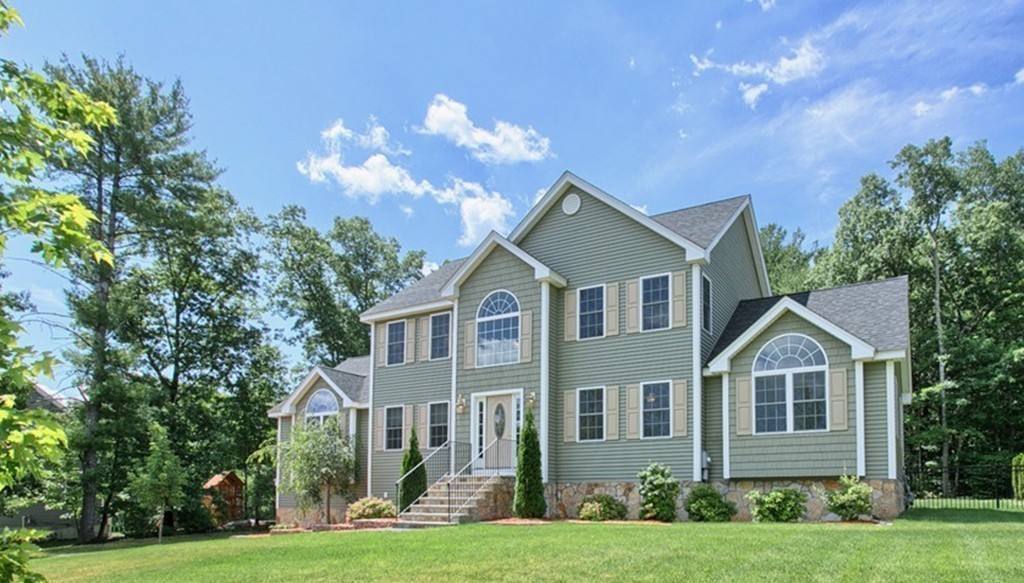 72 Clement Road Dracut, MA 01826 - Photo 2 of 30 a front view of a house with a yard