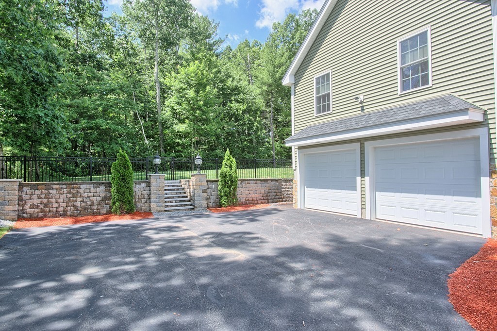 72 Clement Road Dracut, MA 01826 - Photo 4 of 30 a view of a house with a outdoor space