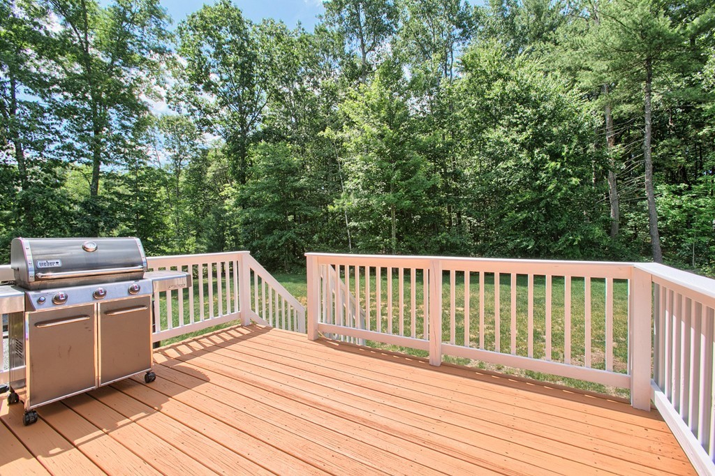 72 Clement Road Dracut, MA 01826 - Photo 7 of 30 a balcony with wooden floor and fence