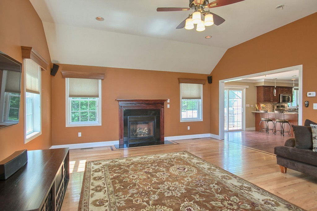 72 Clement Road Dracut, MA 01826 - Photo 10 of 30 a living room with furniture and a fireplace