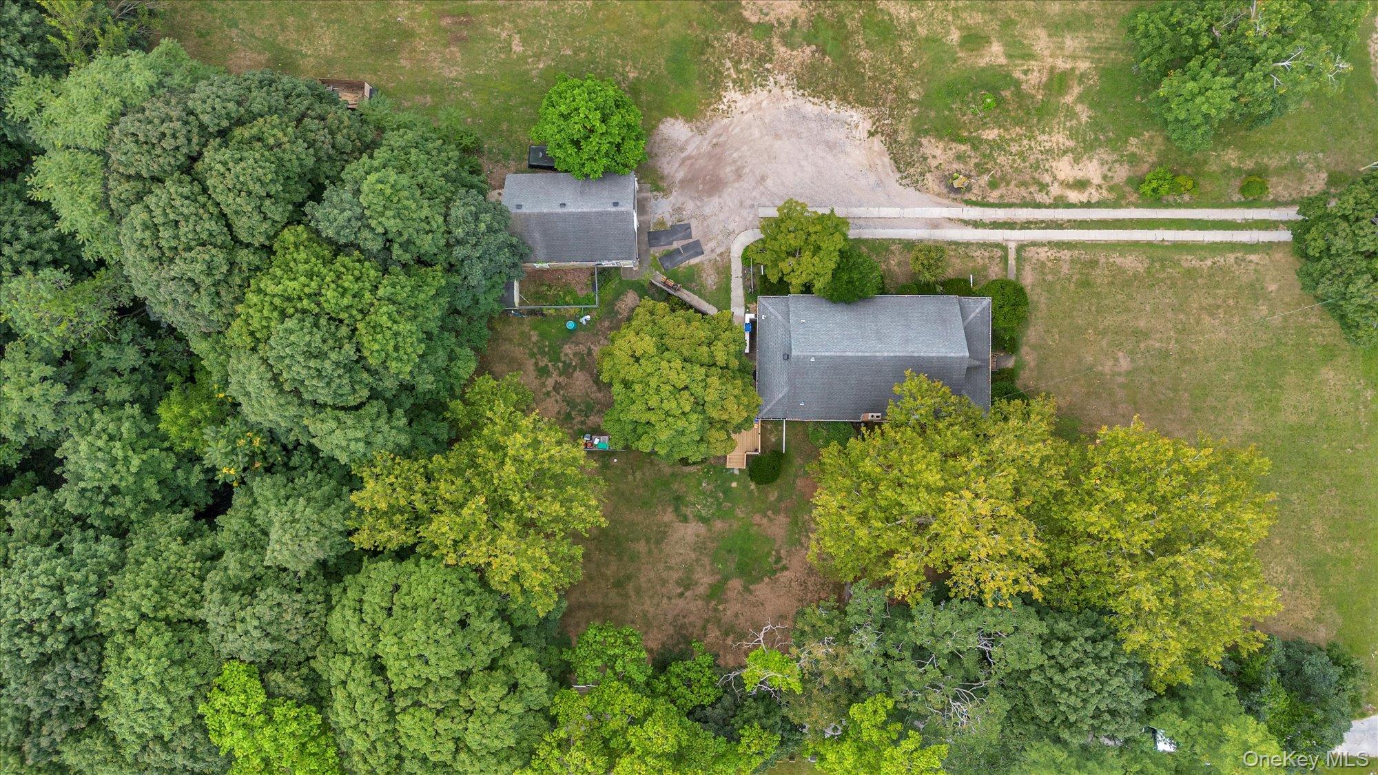 653 Main Road Aquebogue, NY 11901 - Photo 13 of 19 an aerial view of a house with a yard