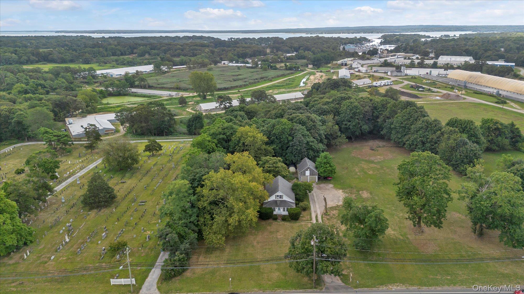 653 Main Road Aquebogue, NY 11901 - Photo 17 of 19 a view of lake with houses