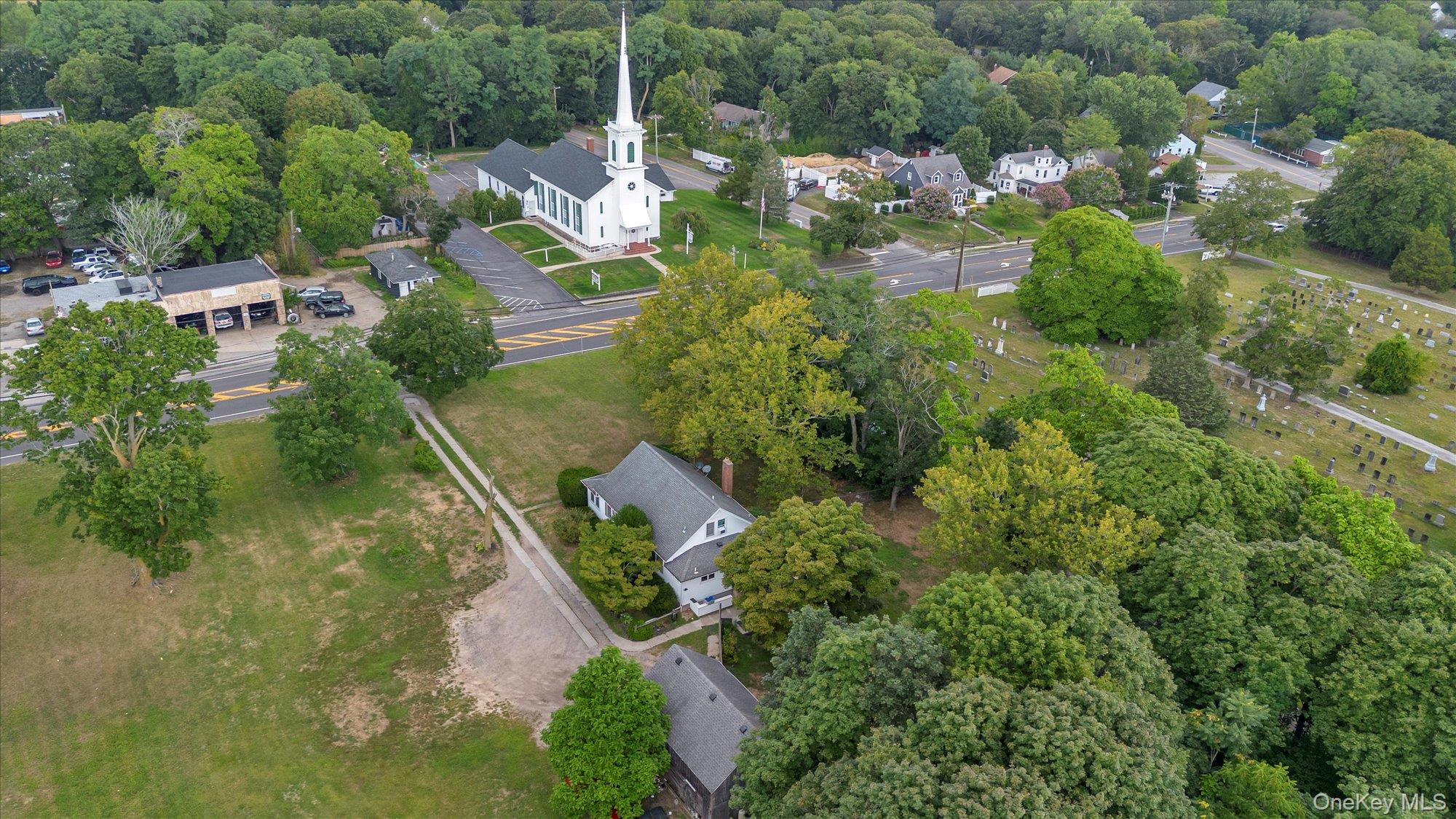 653 Main Road Aquebogue, NY 11901 - Photo 19 of 19 an aerial view of residential house with outdoor space and trees all around