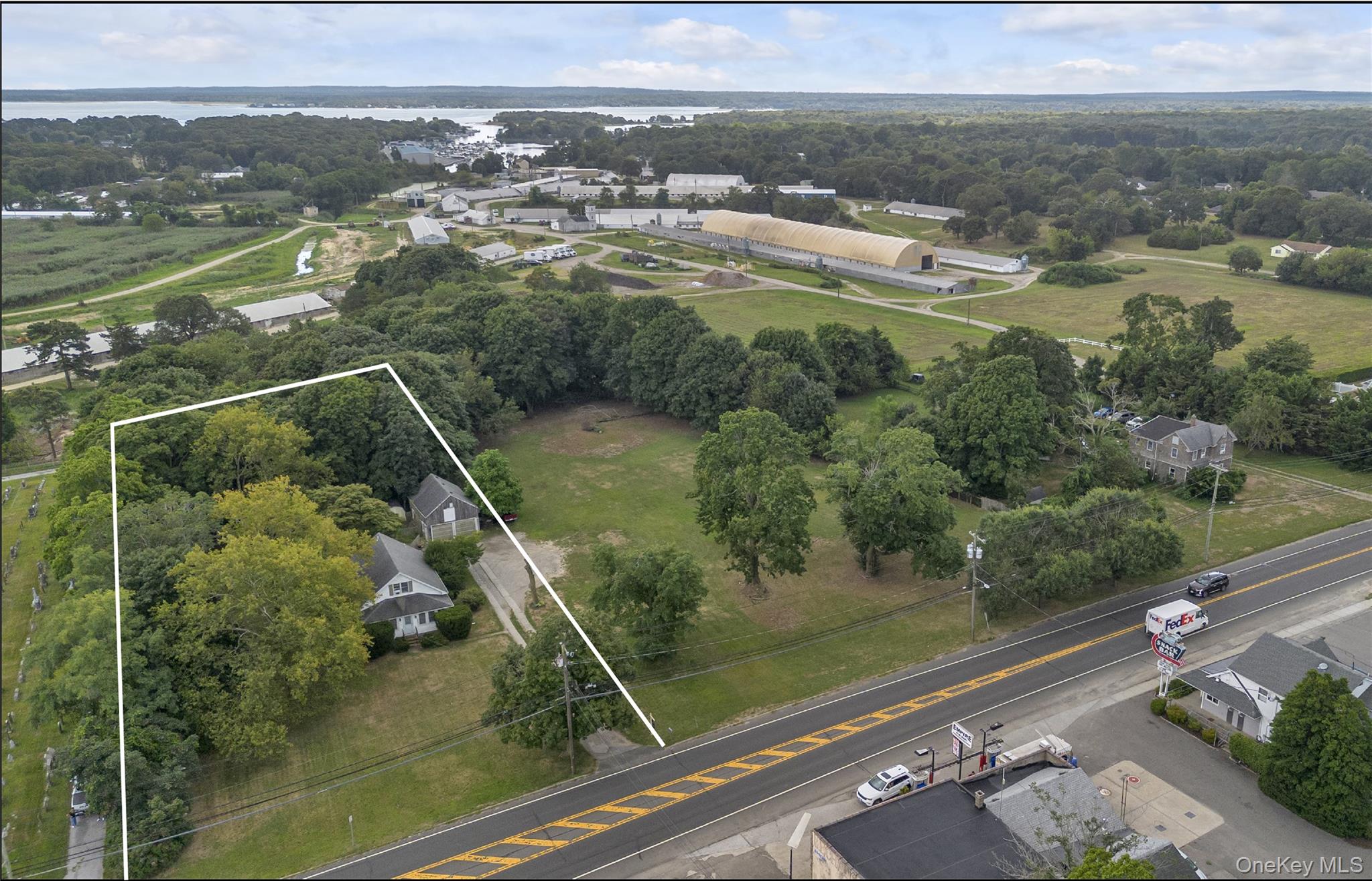 653 Main Road Aquebogue, NY 11901 - Photo 2 of 19 a view of a lake from a balcony