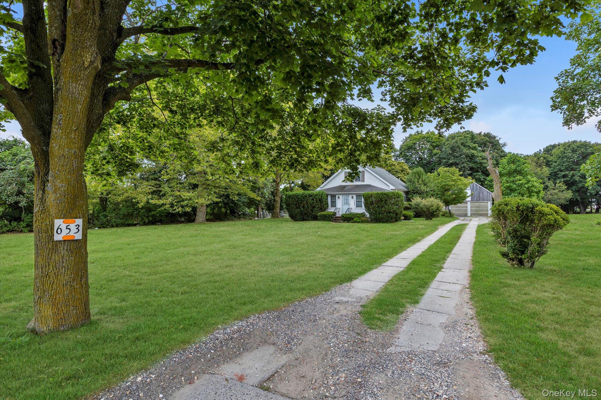 653 Main Road Aquebogue, NY 11901 - Photo 3 of 19 a view of a park with large trees