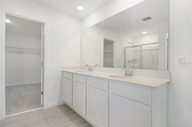 a bathroom with 2 sink and a mirror