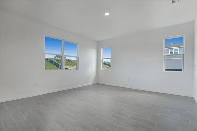 an empty room with windows