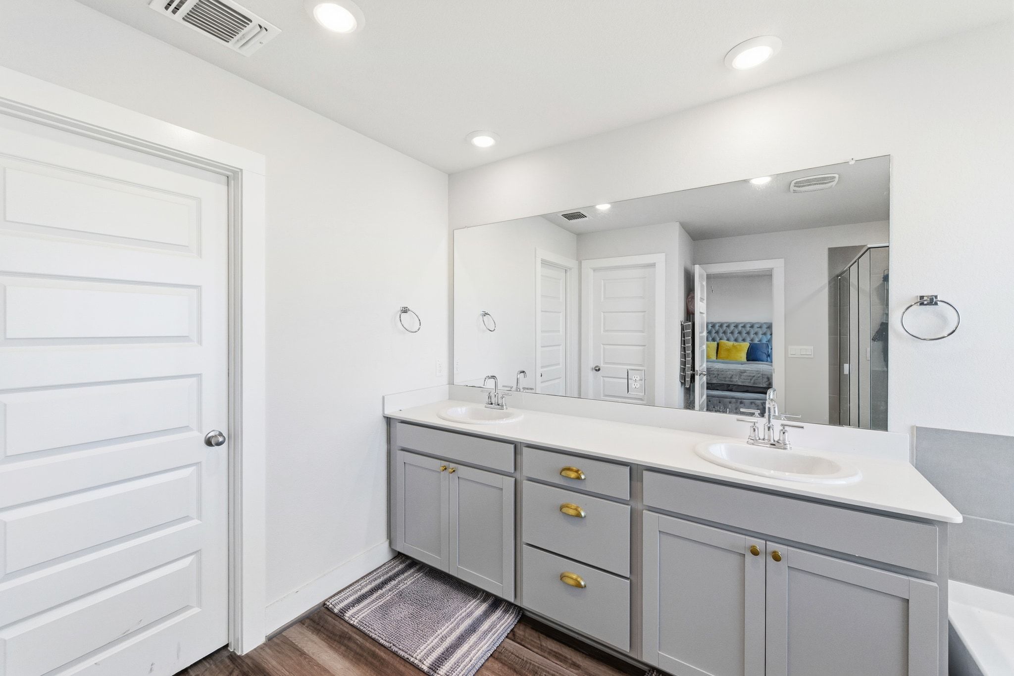 7416 Travertine Spring Drive, Unit 149 Austin, TX 78744 - Photo 22 of 36 a bathroom with a double vanity sink and mirror