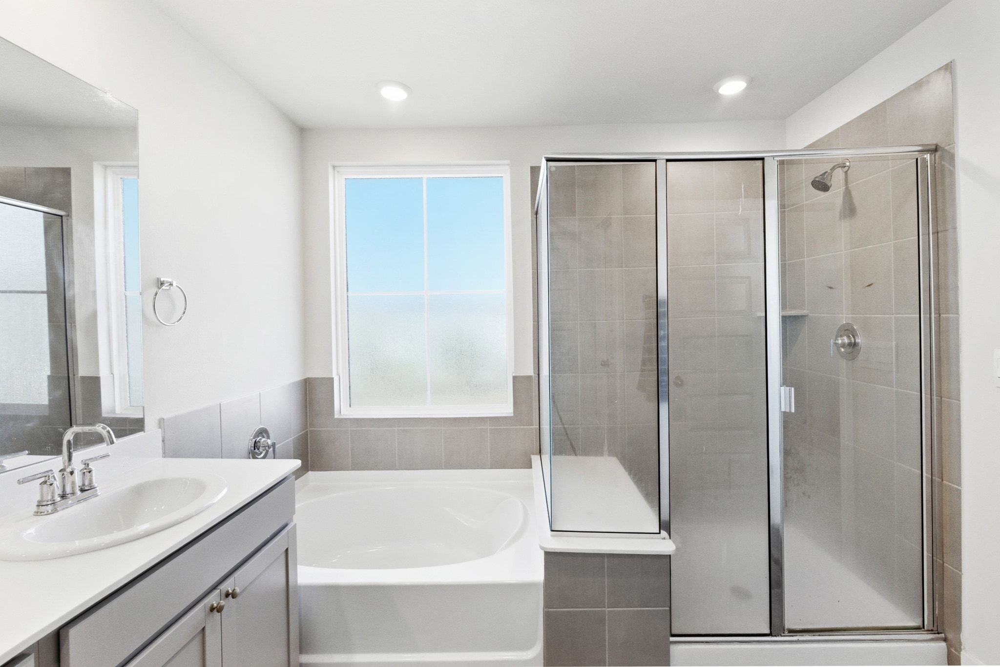 7416 Travertine Spring Drive, Unit 149 Austin, TX 78744 - Photo 23 of 36 a bathroom with a shower and a sink
