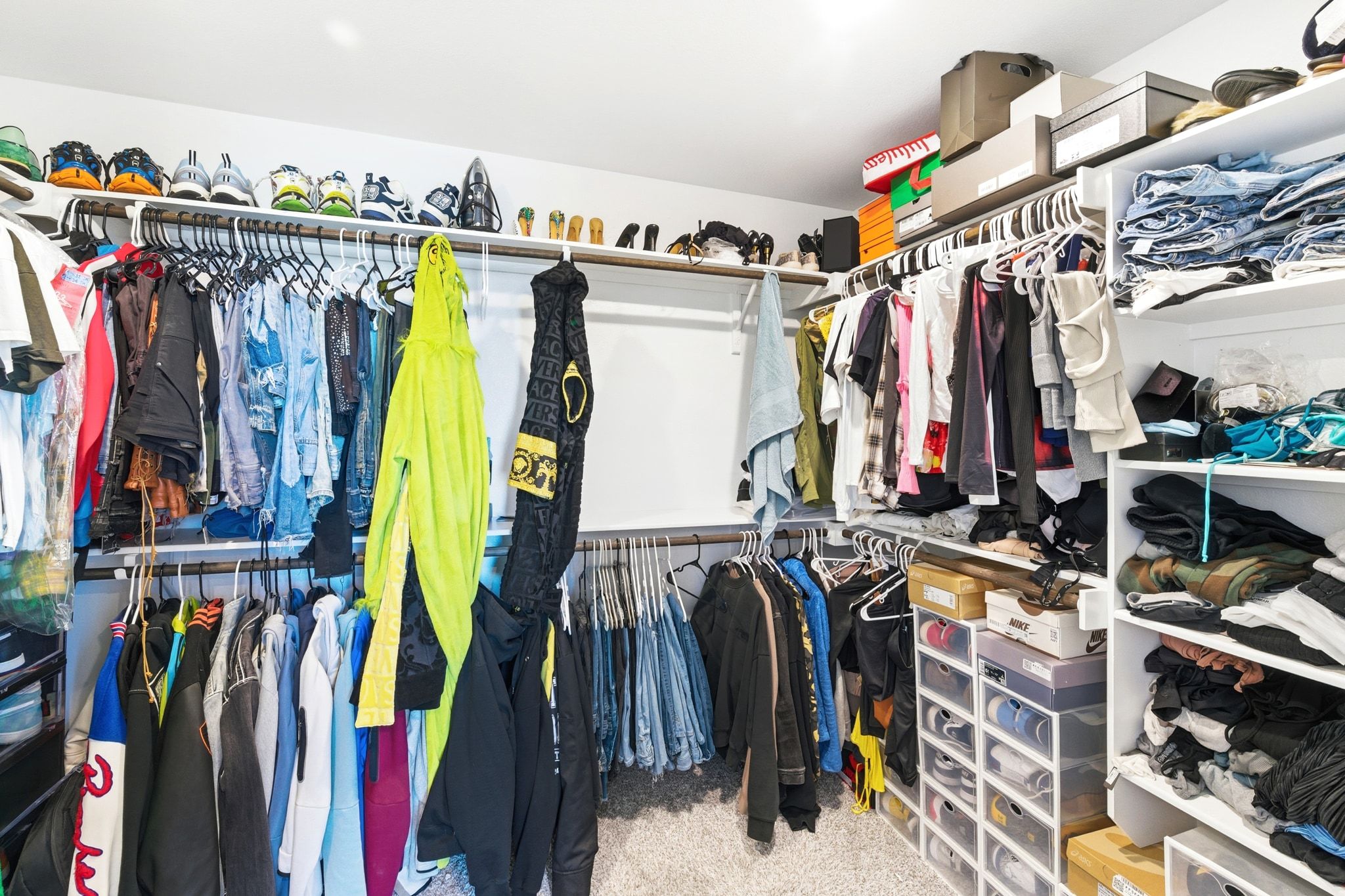 7416 Travertine Spring Drive, Unit 149 Austin, TX 78744 - Photo 24 of 36 a view of walk in closet with clothes