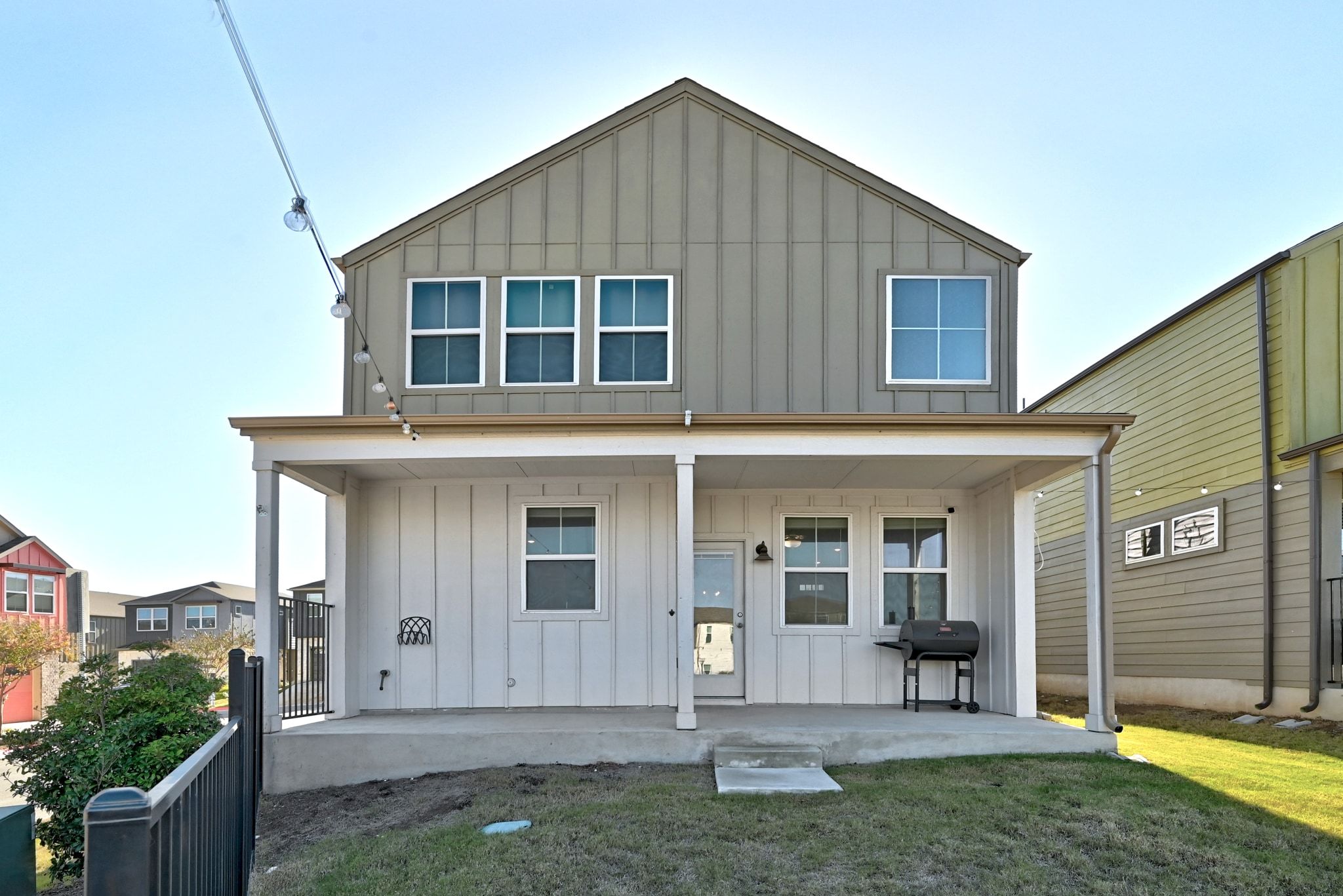 7416 Travertine Spring Drive, Unit 149 Austin, TX 78744 - Photo 34 of 36 a front view of a house with a yard