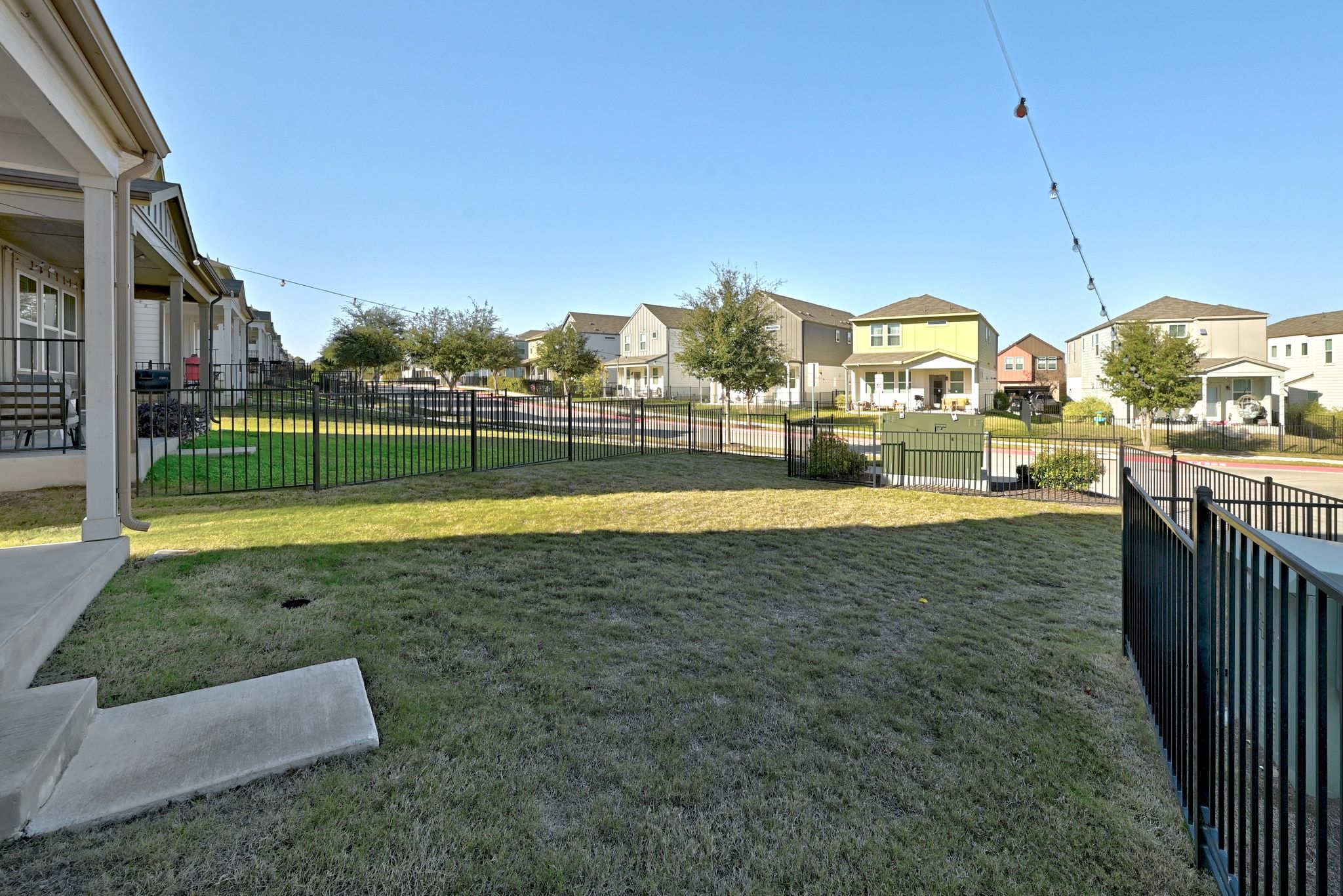 7416 Travertine Spring Drive, Unit 149 Austin, TX 78744 - Photo 4 of 36 a view of a house with a yard