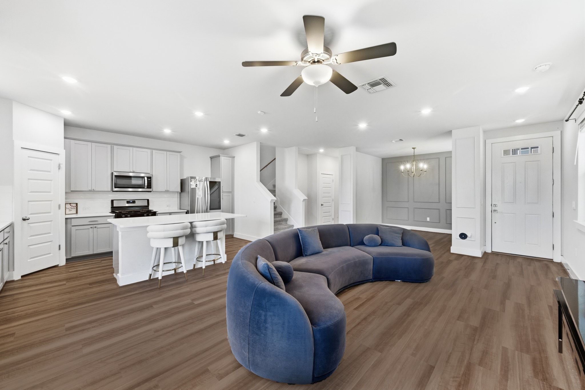 7416 Travertine Spring Drive, Unit 149 Austin, TX 78744 - Photo 6 of 36 a living room with furniture kitchen area and a wooden floor