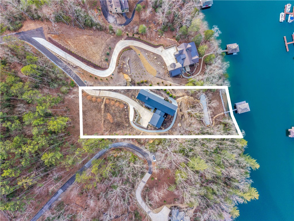 127 Crosswind Court Sunset, SC 29685 - Photo 44 of 49 This aerial view showcases a waterfront property with a private dock and scenic surroundings.