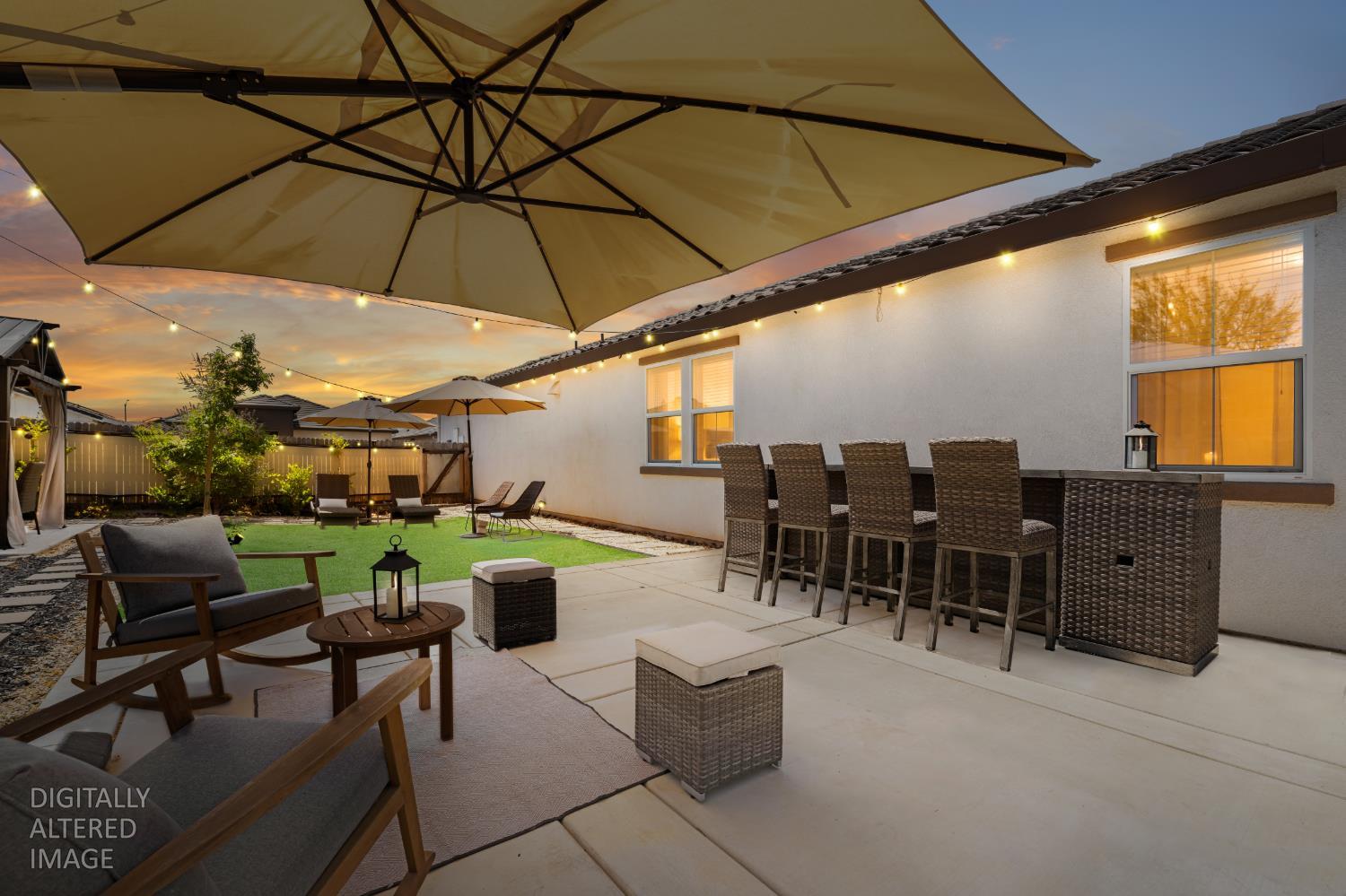 4216 Creede Way Rancho Cordova, CA 95742 - Photo 42 of 56 a view of a patio with table and chairs under an umbrella