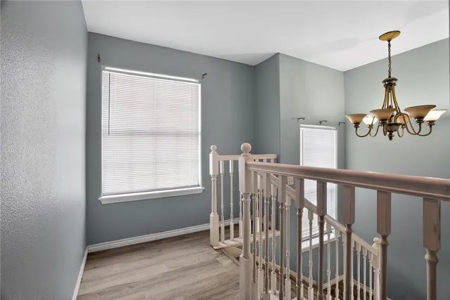 a view of hallway with windows