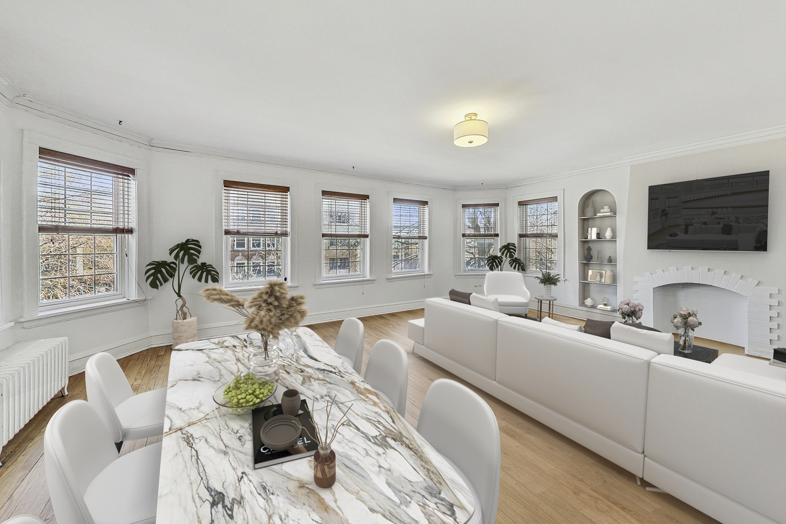 138 Custer Avenue, Unit 2 Evanston, IL 60202 - Photo 2 of 22 a living room with furniture a flat screen tv and a window