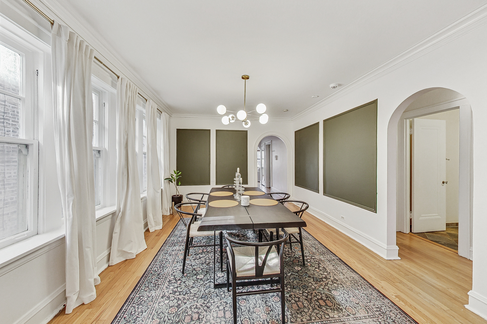 138 Custer Avenue, Unit 2 Evanston, IL 60202 - Photo 9 of 22 a view of a dining room with furniture window and wooden floor