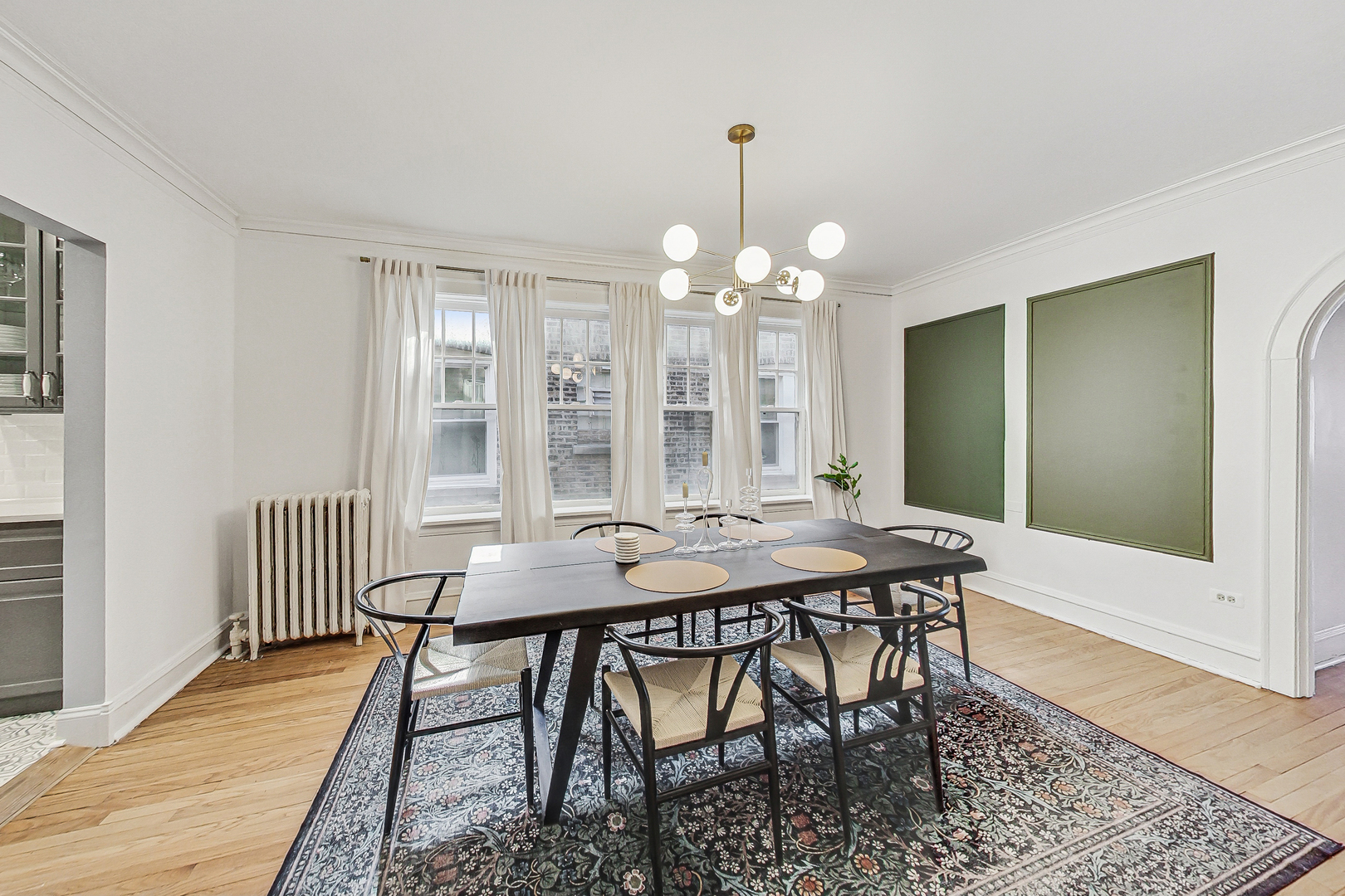 138 Custer Avenue, Unit 2 Evanston, IL 60202 - Photo 10 of 22 a view of a dining room with furniture and wooden floor