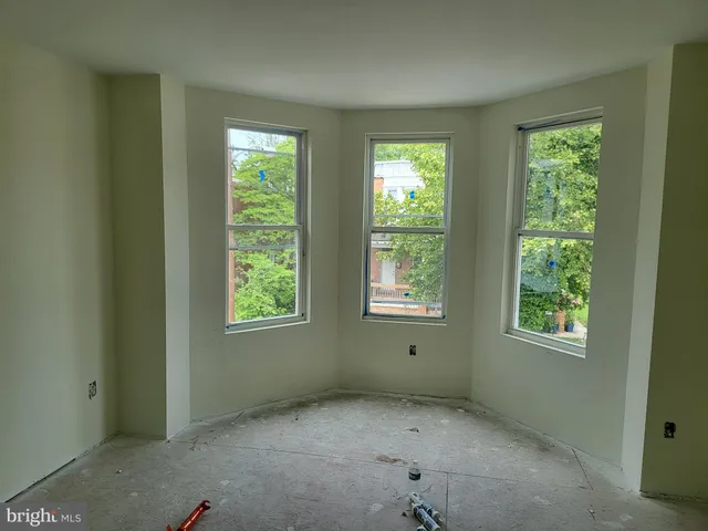 a room with a bed furniture and a window