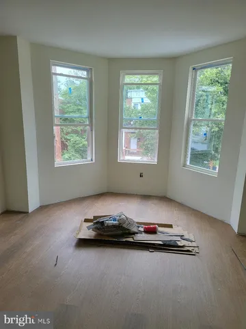a view of a room that has a large window