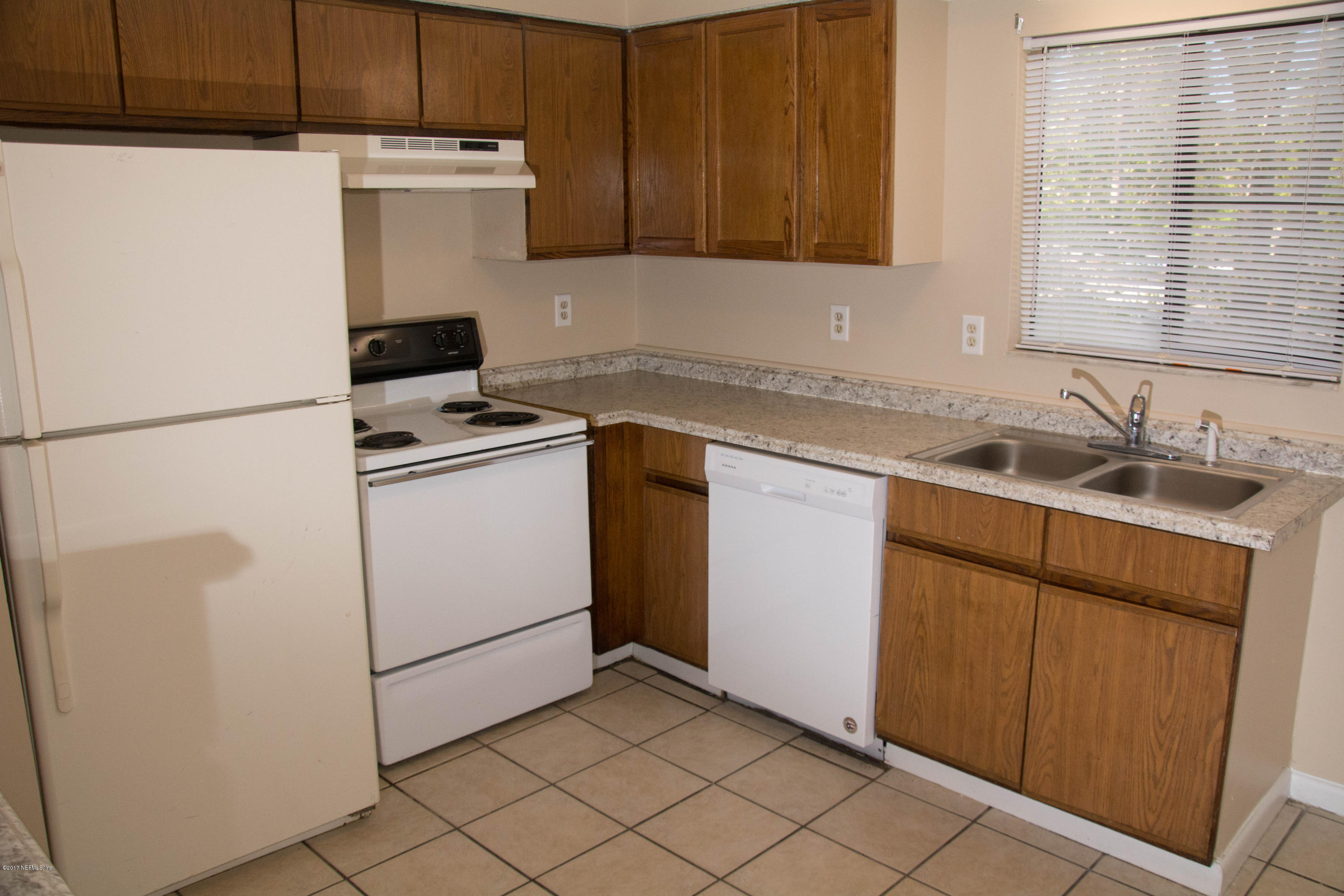 2630 Jammes Road, Unit 403 Jacksonville, FL 32210 - Photo 2 of 10 a utility room with dryer and washer