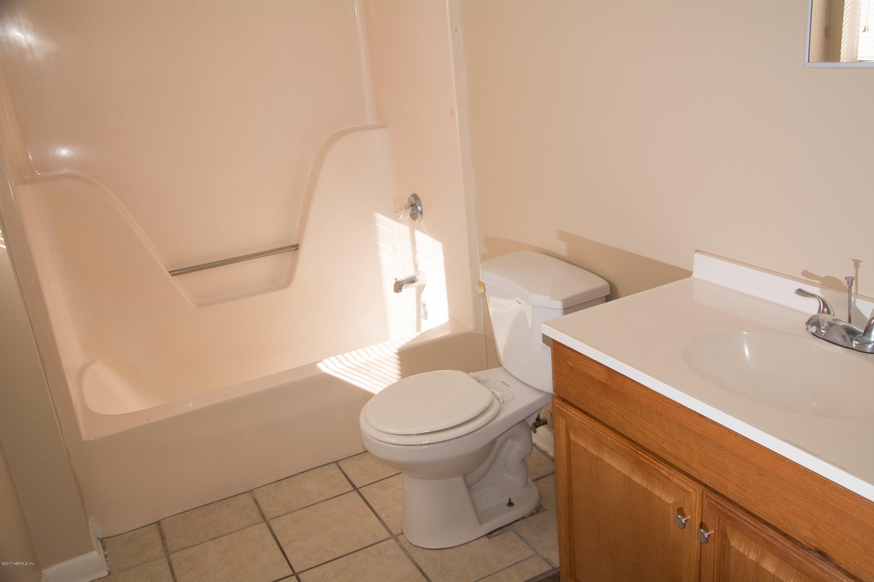 2630 Jammes Road, Unit 403 Jacksonville, FL 32210 - Photo 6 of 10 a bathroom with a sink and a toilet