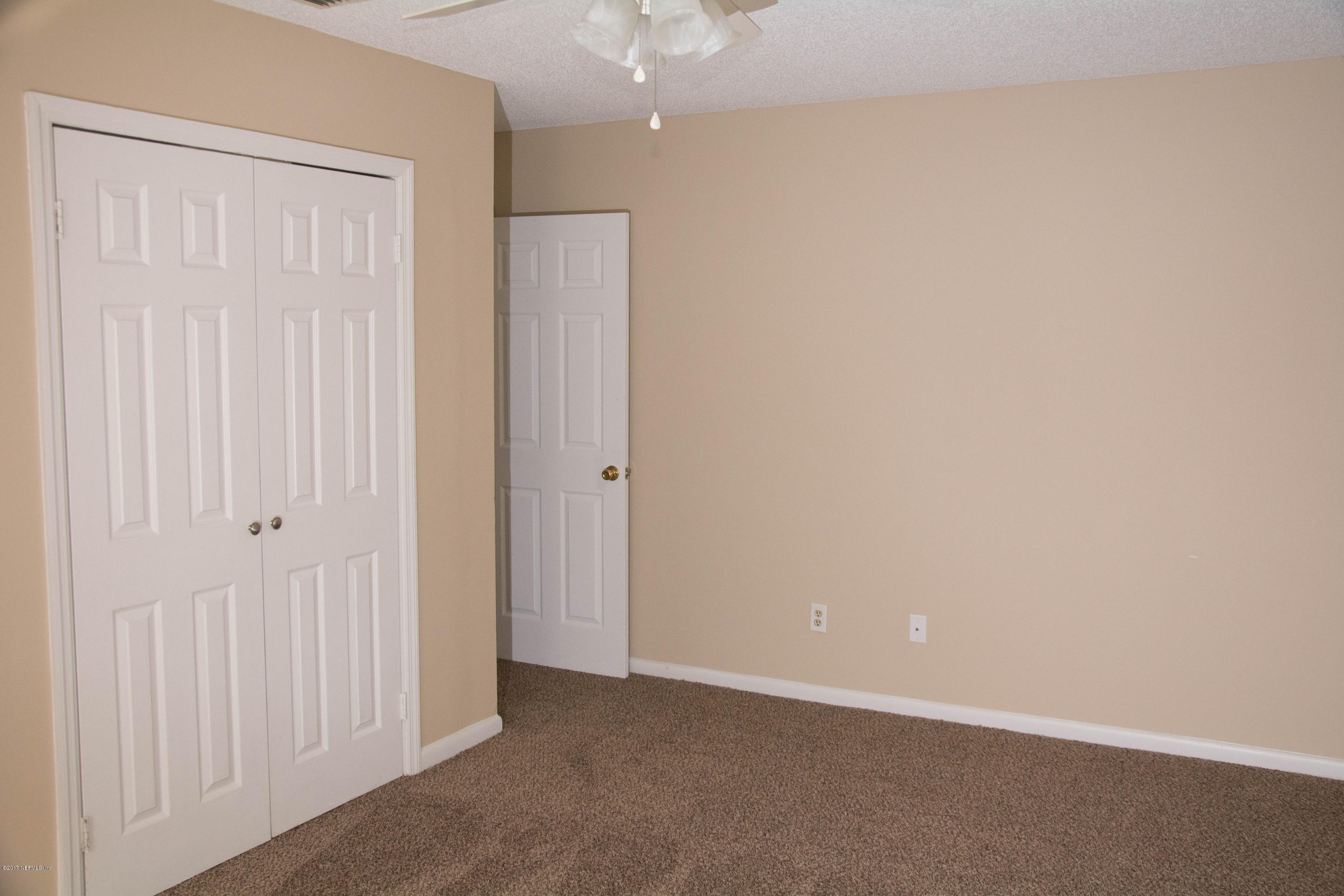 2630 Jammes Road, Unit 403 Jacksonville, FL 32210 - Photo 7 of 10 an empty room with windows
