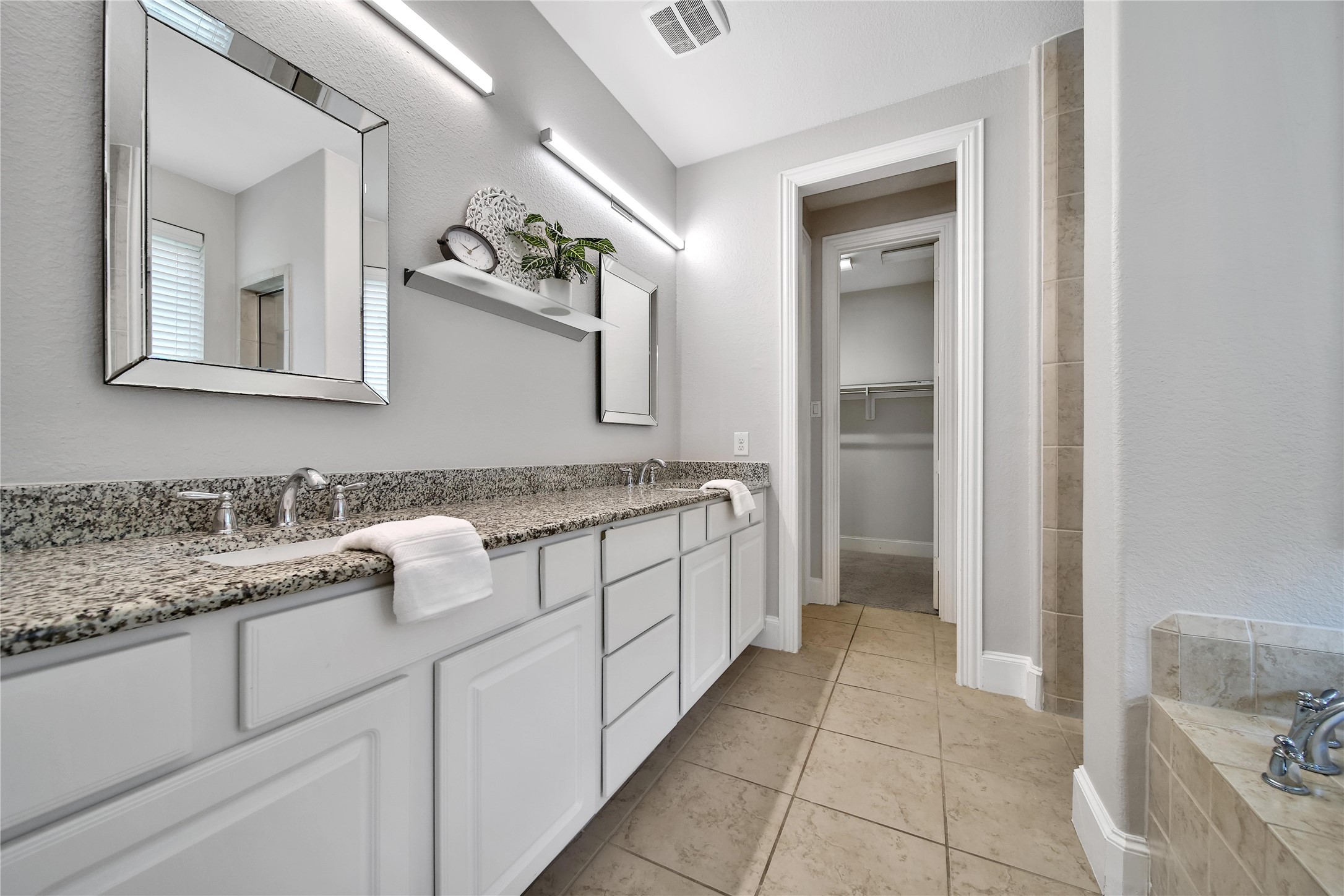 3910 Lupin Bush Lane Manvel, TX 77578 - Photo 14 of 39 a bathroom with a granite countertop sink and a mirror