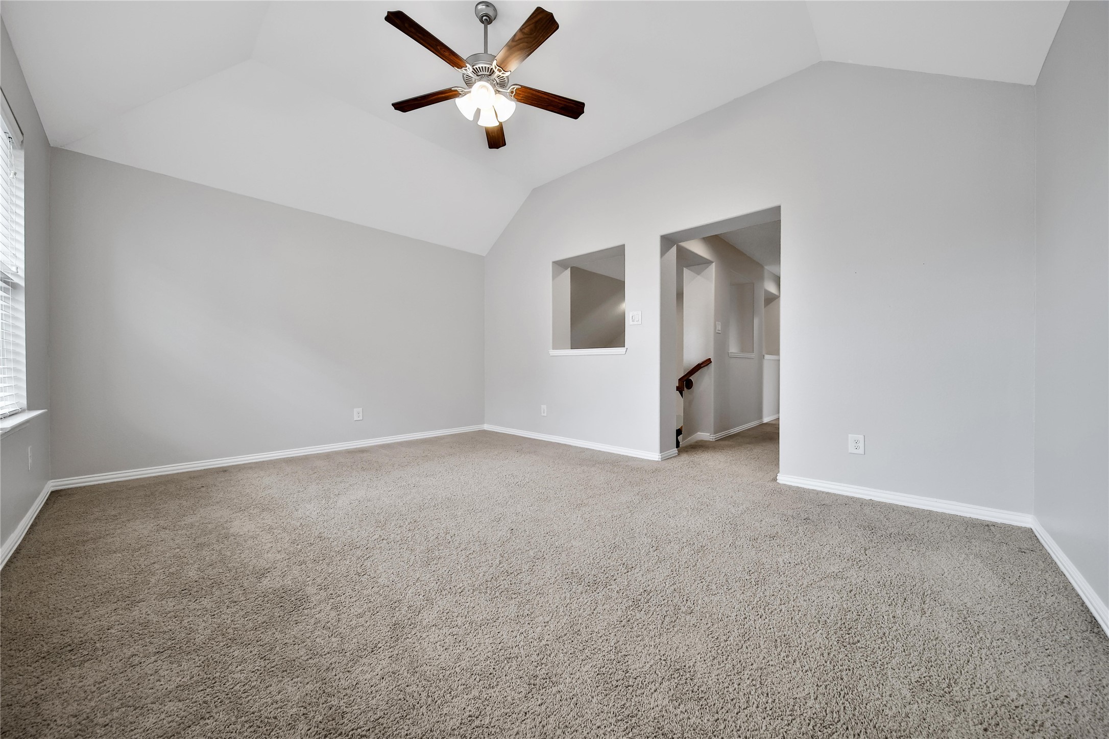3910 Lupin Bush Lane Manvel, TX 77578 - Photo 17 of 39 an empty room with chandelier fan and windows