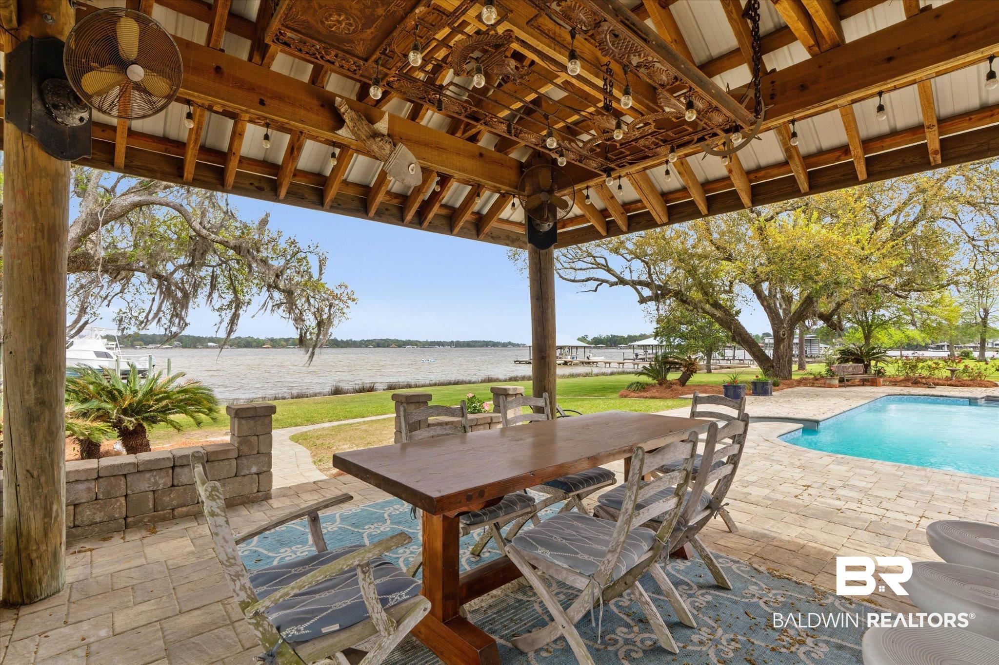 3500 Higgins Road Mobile, AL 36619 - Photo 39 of 54 View of patio featuring an outdoor pool, outdoor dining area, and a water view