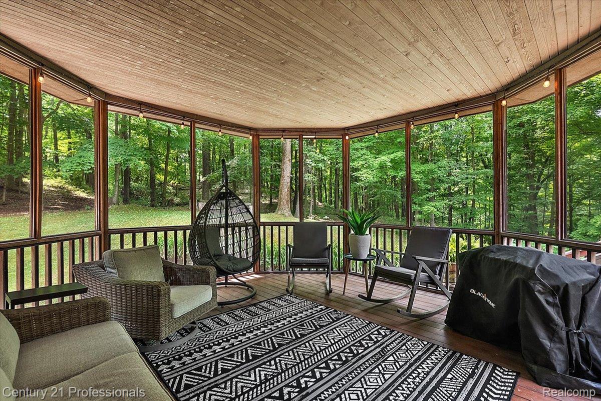 9867 Rainbow Ridge Drive Schoolcraft, MI 49087 - Photo 58 of 82 Expansive screened porch featuring a wood-finish ceiling, wood-finish flooring, and perimeter lighting