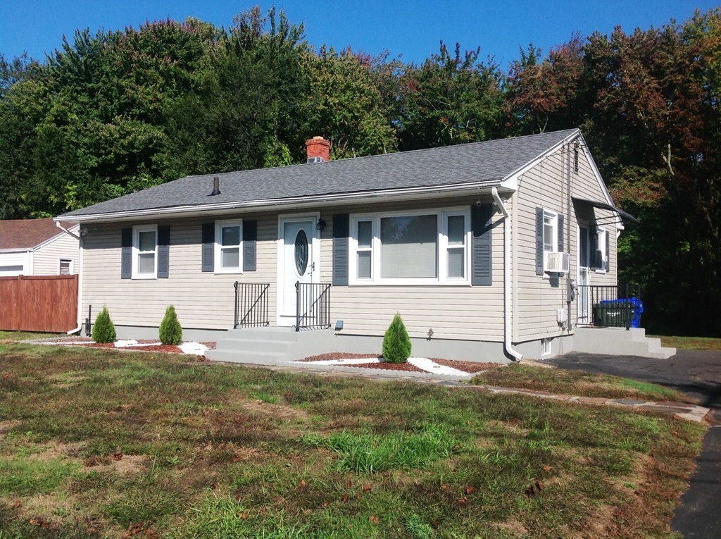 70 Gary Road Springfield, MA 01119 - Photo 1 of 24 a front view of a house with a yard