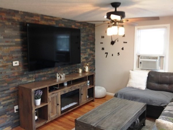 70 Gary Road Springfield, MA 01119 - Photo 12 of 24 a living room with furniture and a flat screen tv
