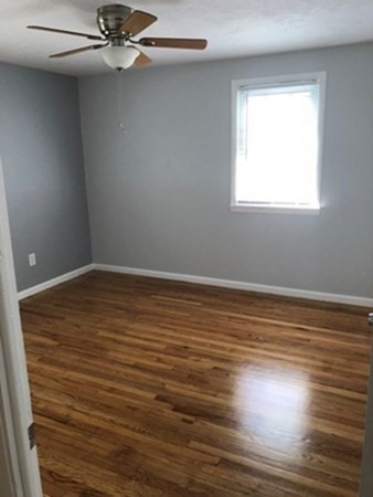 70 Gary Road Springfield, MA 01119 - Photo 15 of 24 wooden floor in an empty room with a window
