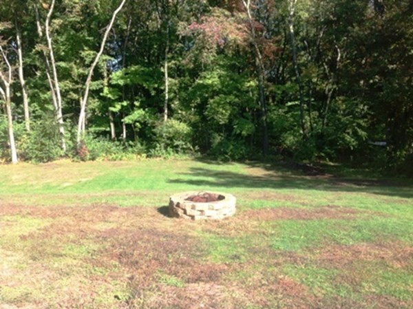 70 Gary Road Springfield, MA 01119 - Photo 24 of 24 a backyard of a house with lots of green space and fountain