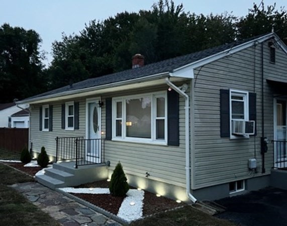 70 Gary Road Springfield, MA 01119 - Photo 4 of 24 a front view of a house with a yard