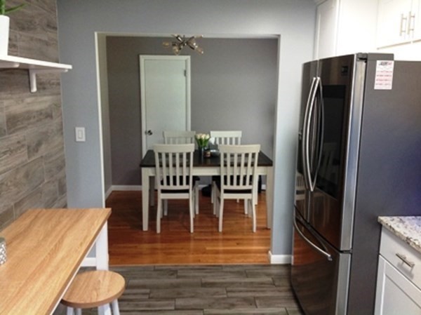 70 Gary Road Springfield, MA 01119 - Photo 7 of 24 a dining room with furniture and wooden floor