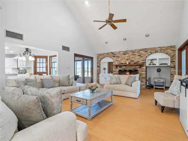 a spacious bedroom with a bed and a couch